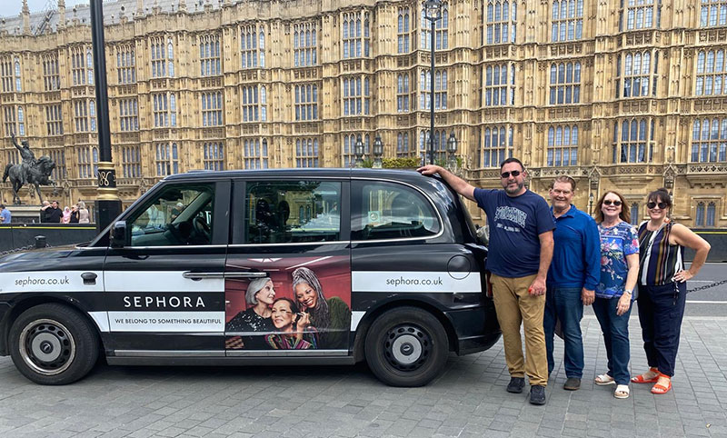Black Taxi London tour party Black Taxi Tour Party beside a cab in London